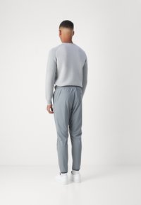 BOSS Tracksuit bottoms - dark beige