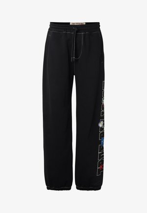 Pantaloni jogger neri con coulisse, polsini elastici, cuciture bianche, ricamo floreale e etichetta "TRUE RELIGION" sulla fascia in vita.