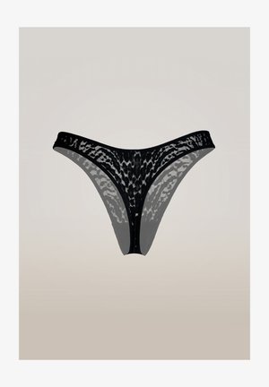 Perizoma in pizzo nero con un motivo floreale trasparente e una sottile fascia in vita, esposto su uno sfondo neutro e chiaro.