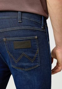 Wrangler GREENSBORO - Straight leg jeans - rustic navy