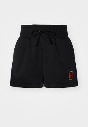 Sorte treningsshorts laget av mykt stoff, med elastisk midje og snøring, samt en liten logo-lapp med farget kant.