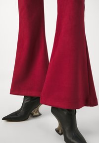 Psychedelic Overdose DEVIL PANTS - Παντελόνι - red