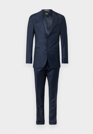 Navy blue suit consisting of a blazer and trousers. Blazer features a two-button closure and notched lapels. Smooth fabric texture throughout.