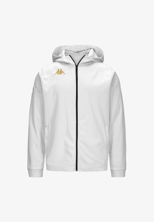Veste à capuche blanche avec une fermeture éclair noire, logo Kappa doré sur la poitrine gauche et deux poches latérales ; texture lisse et design athlétique.