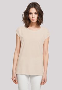 Beige short-sleeve t-shirt made of soft fabric with a round neckline and a relaxed fit, featuring a straight hem and subtle texture.
