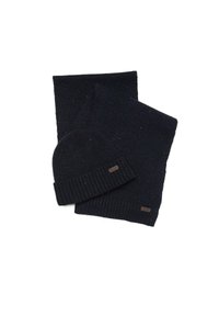 Set de căciulă și fular tricotate de culoare bleumarin, cu margini canelate; fularul se potrivește cu căciula, având pete colorate pe tot parcursul; accentuat cu un eticheta mică.