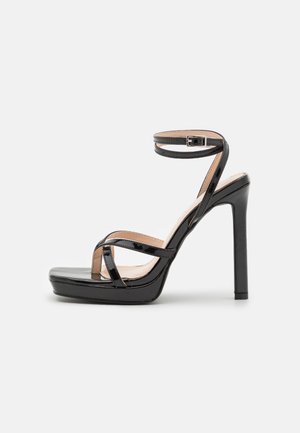 RAID DIMONA - Magas sarkú szandálok - black