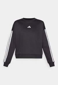Črna majica s dolgimi rokavi, ki ima na prsih belo Adidasovo logo in bele črte po vsakem rokavu. Mehka tkanina, okrogla vratna izreza.