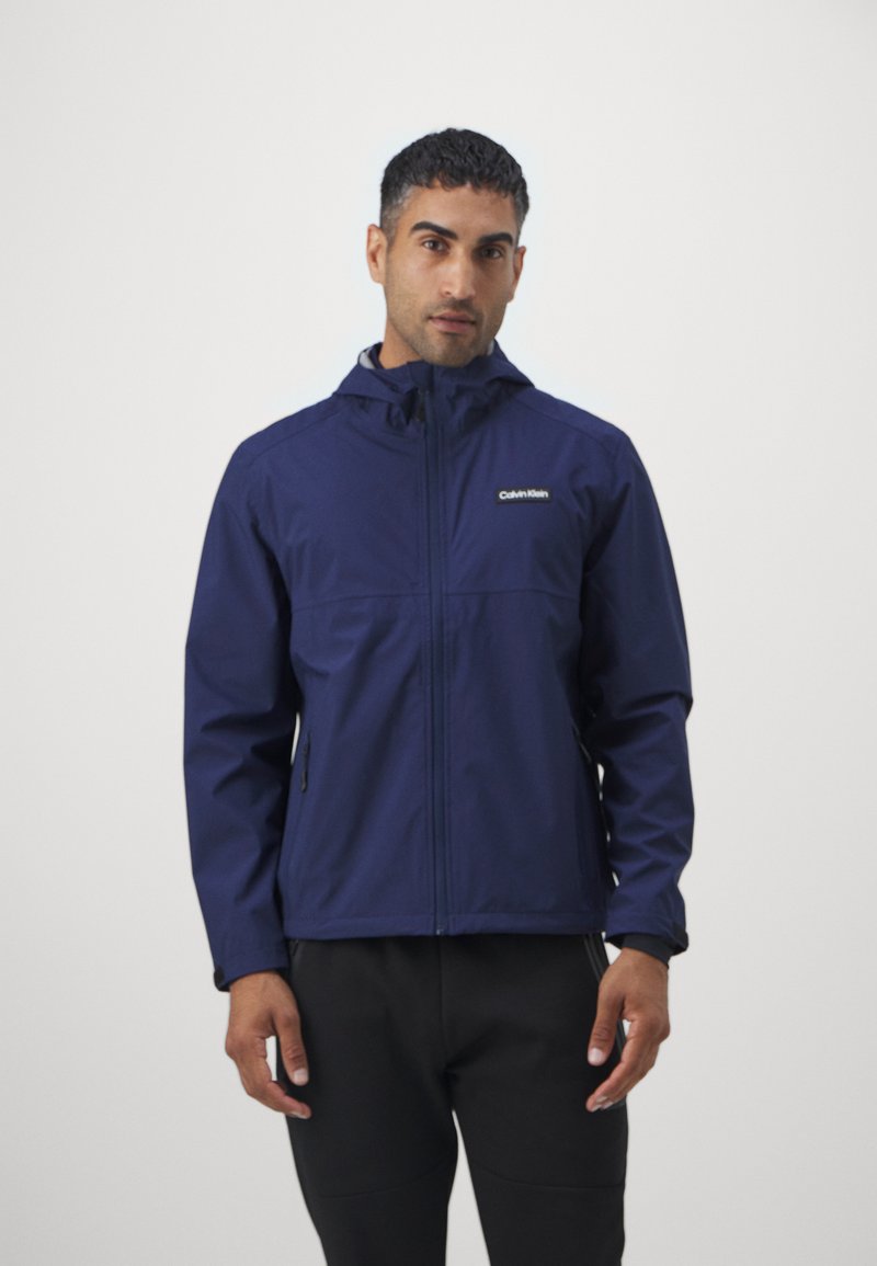 Calvin Klein Golf FEATHER DRY WATERPROOF SHELL JACKET - Vodotěsná bunda - navy