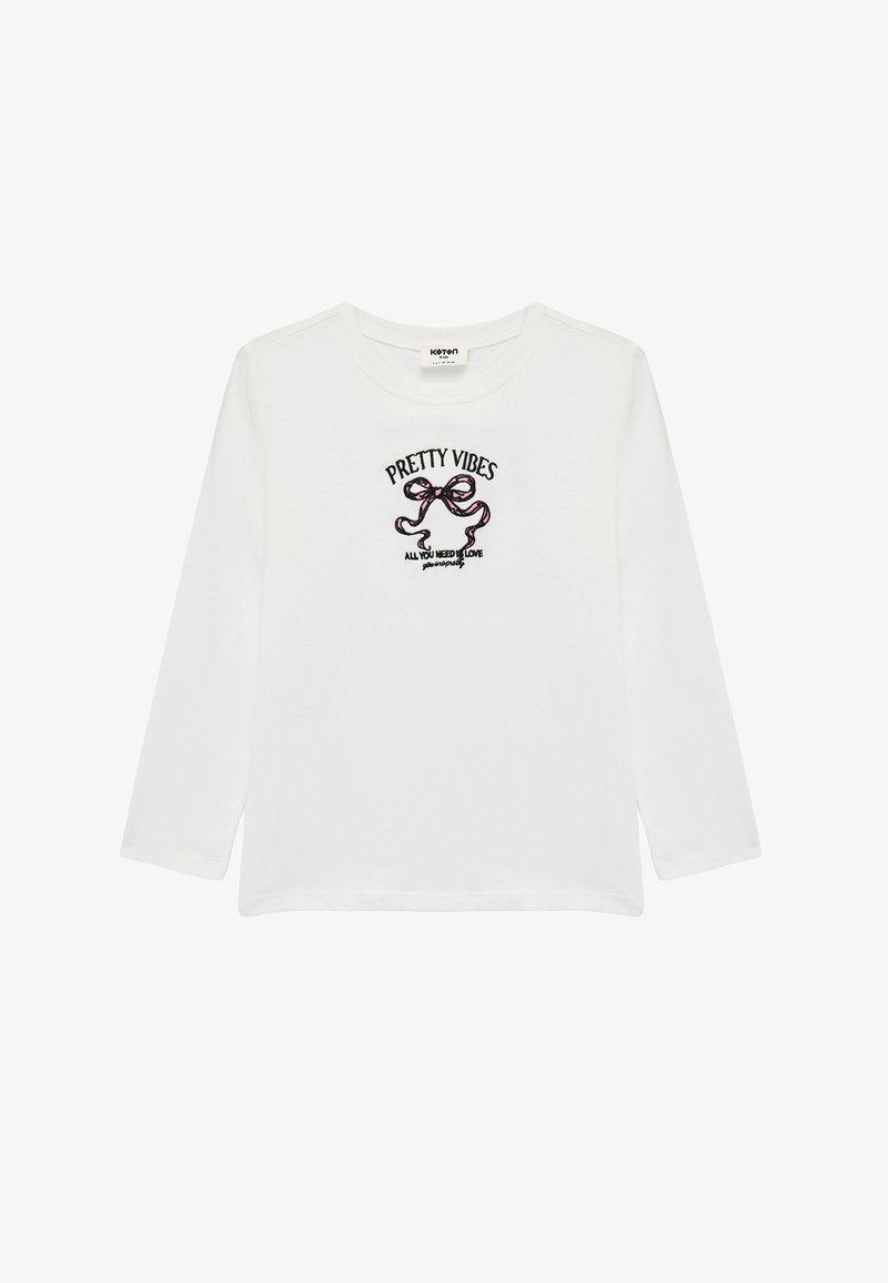 Langærmet hvid T-shirt lavet af blødt bomuld. Har "Pretty Vibes" og et buegrafik i flerfarvet broderi i midten.