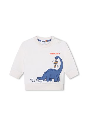 Maglietta bianca a maniche lunghe per bambino con dinosauro blu che tiene un stivale arancione, impronte nere e logo "Timberland" arancione sul petto.