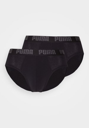 Conjunto de ropa interior de algodón negro con una cinturilla impresa con logo. Diseño clásico de braguitas con textura suave y detalles de costura precisos.