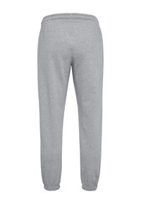 Graue Jogginghosen aus weichem Stoff, mit einem elastischen Bund und Bündchen, im geraden Bein Design und ohne zusätzliche Muster.