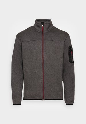 Chaqueta de forro polar con cremallera completa en gris oscuro, cuello alzado, ribete de cremallera negro y pequeño bolsillo con cremallera en la parte superior izquierda de la manga.