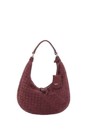 Woven burgundy handbag with a curved shape, a top handle, and a front bow detail. Features a zip closure and a small brand tag attached.