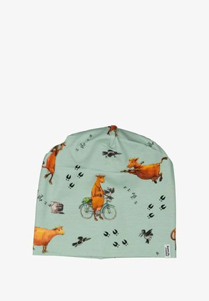 Puuvillapipo vaaleanvihreänä, jossa on sarjakuvamaisia lehmiä, lintuja ja eläinjälkiä. Ominaisuuksiin kuuluu pehmeä tekstuuri ja kootut huiput käytettävyyden takaamiseksi.