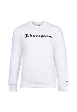 Sudadera blanca de manga larga con logo en script negro "Champion" en el pecho y pequeño emblema de Champion en el puño izquierdo.