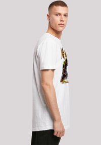 White cotton t-shirt featuring a colorful graphic design at the front, with short sleeves and a relaxed fit. Plain back and crew neckline.