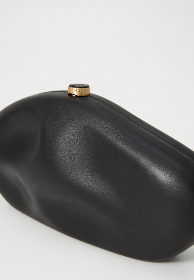 Black leather clutch bag with a smooth texture, rounded shape, and a gold-tone metal clasp featuring a logo detail at the top.