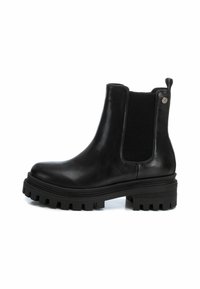 Botas Chelsea de cuero negro con paneles laterales elásticos, suela de goma texturizada y un ligero tacón. Diseño de tacón notable para mayor tracción.