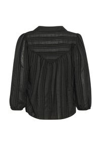 Melnā auduma blūze ar vertikālām svītrām, garām pūkām un savilktiem aizmugures elementiem. Iespējama klasiskā apkakle un brīvs piegriezums.