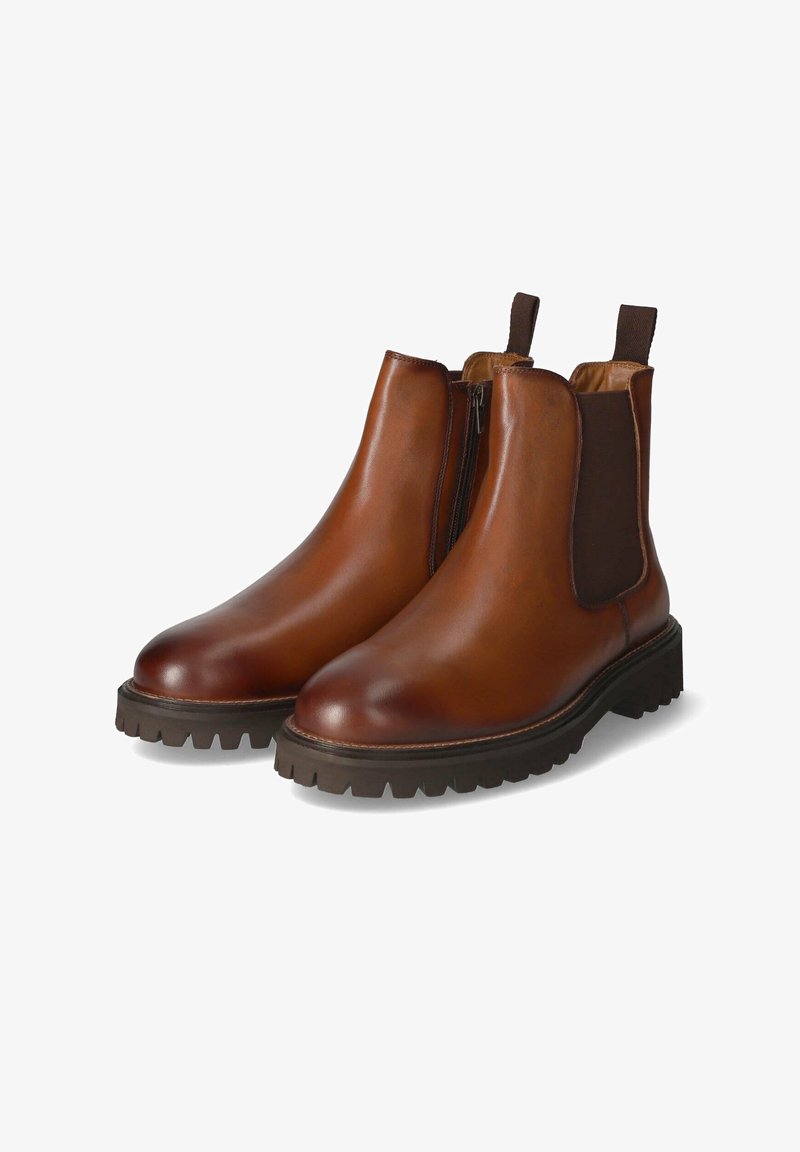 Brown leather Chelsea boots with elastic side panels, rounded toe, and textured rubber sole featuring deep tread for grip.