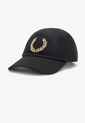 Casquette de baseball noire avec une visière courbée et une couronne de laurier dorée brodée sur le devant, sur fond blanc.