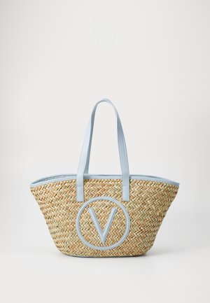 Nertos šiaudų pirkinių krepšys su šviesiai mėlynomis sintetinio odos rankenomis ir apvadu.  Pasižymi ryškiu mėlynu iškilniu apvaliu logotipu.