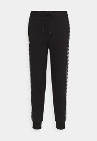 Zwarte trainingsbroek met een trekkoord in de taille, slim fit en witte zijstrepen met een herhalend patroon. Zacht, rekbaar materiaal.