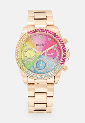 Gold-tone watch with a rainbow gradient dial, crystal accents around the bezel, three sub-dials, and a linked bracelet strap.