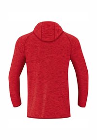 Maglione rosso a maniche lunghe con cappuccio, realizzato in un tessuto testurizzato, caratterizzato da un cappuccio rotondo, cuciture a vista e un orlo dritto in vita.