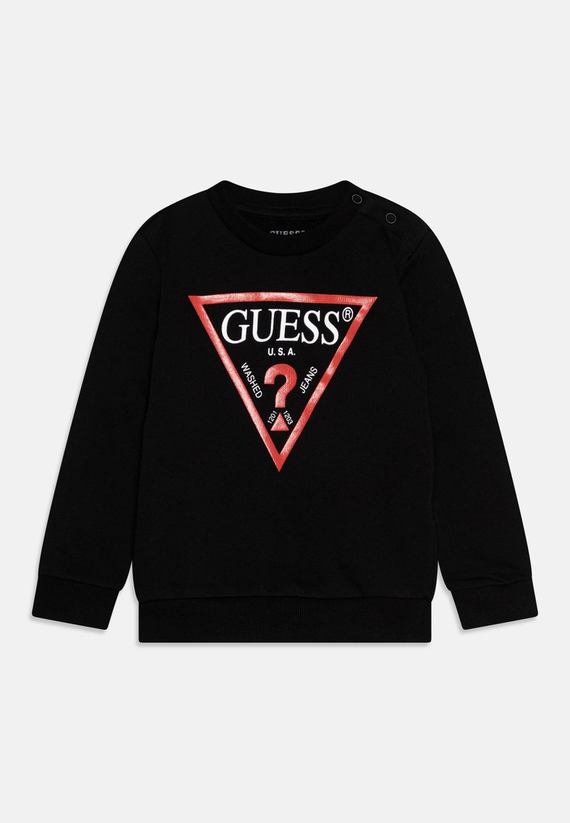 Svart sweatshirt laget av bomull med rund hals. Har en rød trekantet logo med "GUESS" i fet skrift og trykknappdetaljer på skulderen.