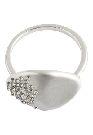 Silver ring with a smooth oval face, decorated with clustered small clear crystals on one side.