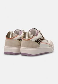 High-top sneakers with a white leather and beige suede upper, metallic gold accents, animal print detailing, and a purple rubber sole.