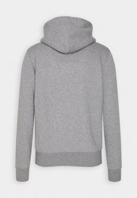 Grau Hoodie mit einer verstellbaren Kapuze und langen Ärmeln. Hergestellt aus weichem Stoff, verfügt es über gerippte Bündchen und einen gerippten Saum für eine enganliegende Passform.