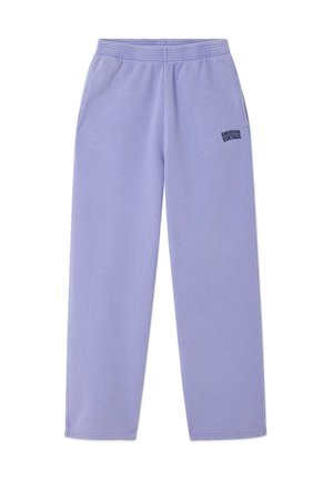 Pantalon de survêtement violet clair en tissu doux avec une taille élastique, des poches latérales et un petit logo noir sur la partie supérieure de la cuisse gauche.