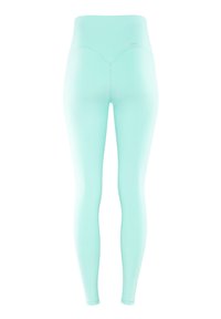 Mentazöld leggings magas derekkal, sima textúrával és testhezálló dizájnnal. Minimális varrási részletek és látható fémalkatrészek nélkül.