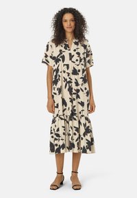 Kleid mit Blumenmuster, kurzärmlig in Creme, mit schwarzen und burgundfarbenen Akzenten, einem plissierten Oberteil und einem gestuften Rock.