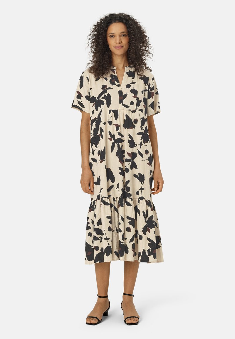 Kleid mit Blumenmuster, kurzärmlig in Creme, mit schwarzen und burgundfarbenen Akzenten, einem plissierten Oberteil und einem gestuften Rock.