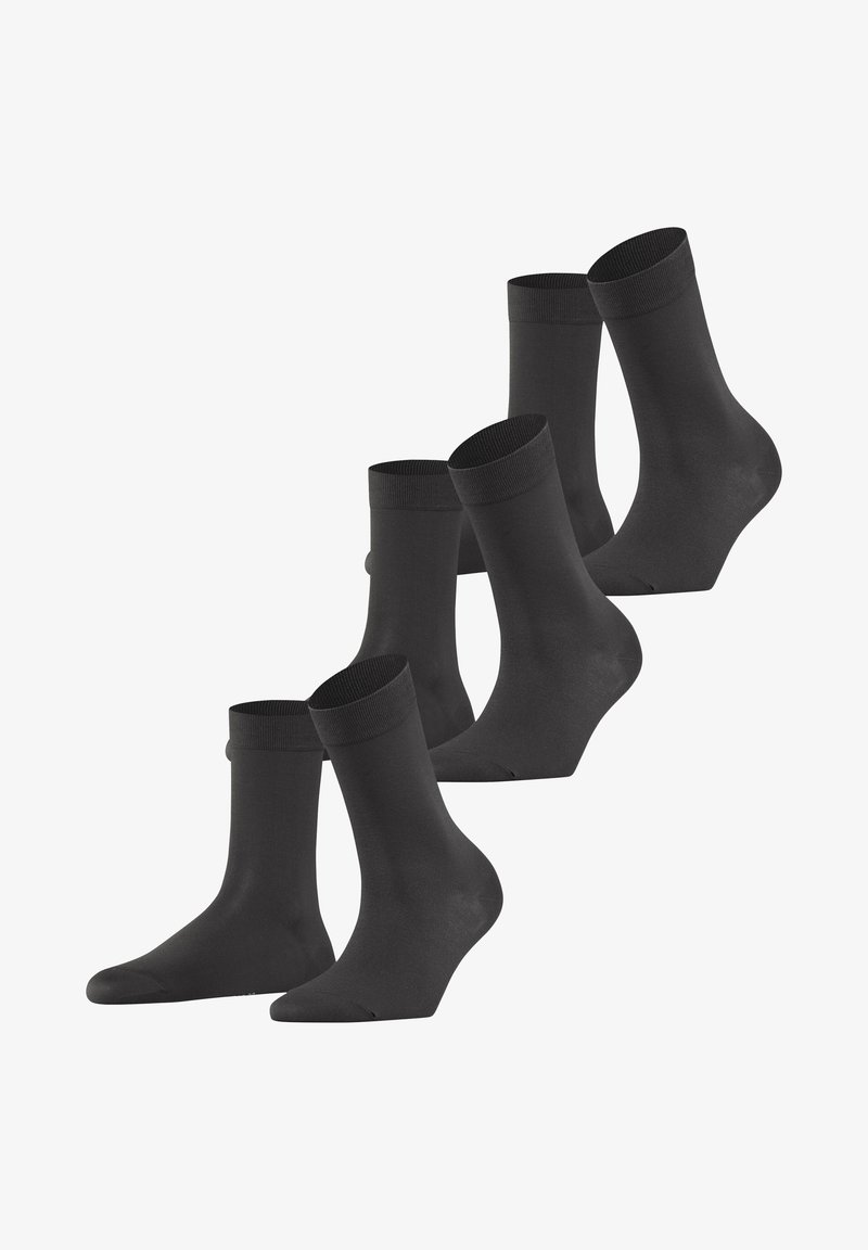 Calcetines de algodón negros de caña corta con puños elásticos acanalados, textura suave y longitud estándar, dispuestos en un grupo de cinco.