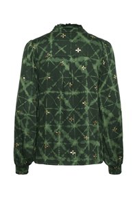Green blouse with long sleeves, featuring a textured pattern of gold flowers and abstract lines. Ruffled neckline and gathered cuffs.