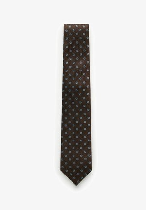 Brun slips med små, jævnt fordelte blå blomsterprint på hvid baggrund.