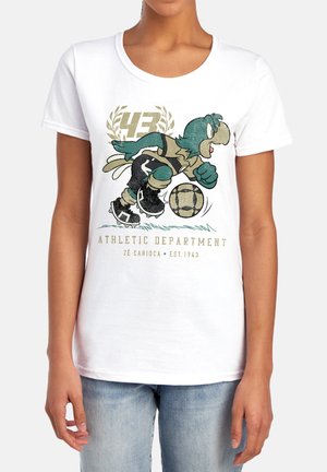 Person wearing white t-shirt featuring cartoon bird playing soccer with number 43 and text "Athletic Department Zé Carioca Est.1943".