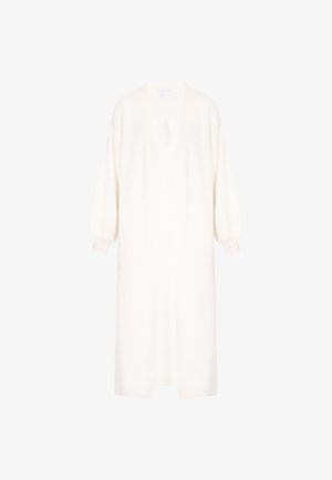 Weiße Strickjacke aus strukturiertem Strickstoff, mit tiefem V-Ausschnitt, übergroßen Ballonärmeln und geradem Schnitt.