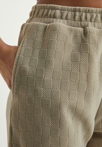 Urban Classics Pantalon de survêtement - unionbeige