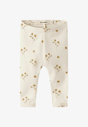 Beige katoenen leggings met een verspreid bloemenpatroon in verzachte goudtinten, met een zachte tailleband en gestikte zoomdetails.