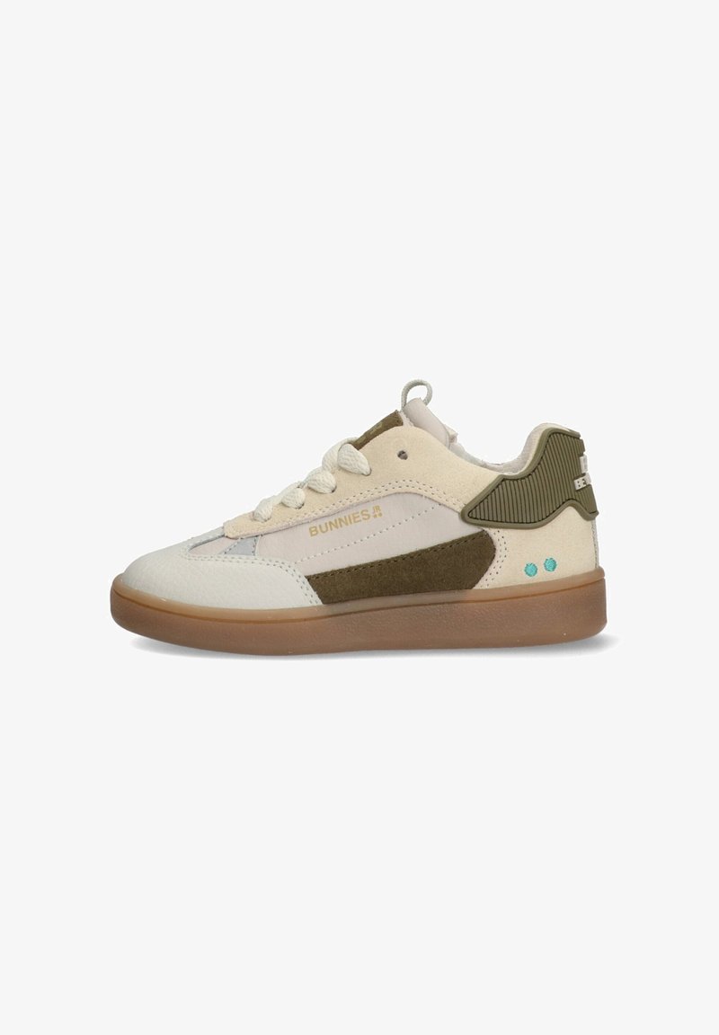 Sneakers featuring a white leather upper with green suede accents, a light gray panel, beige laces, and a gum rubber sole.