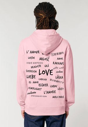 Felpa con cappuccio rosa che presenta varie lingue che scrivono "amore" in una tipografia nera in grassetto su tutta la schiena. Tessuto morbido con vestibilità standard.