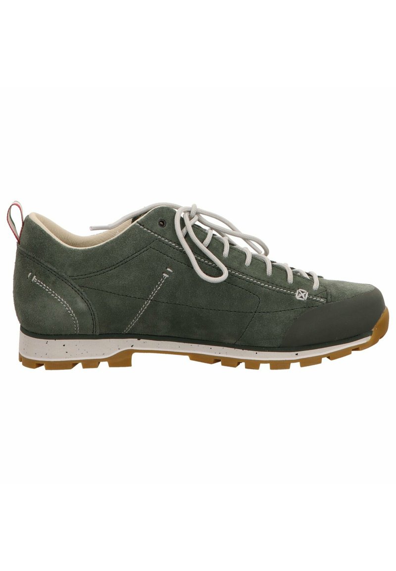 Green suede shoe with white laces, a reinforced toe, and a textured rubber outsole. Features subtle stitching and a branded detail near the laces.