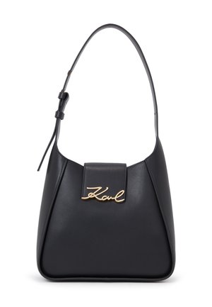 Black leather handbag with a curved shape, a short strap, and a gold signature logo on the front. Smooth texture, minimalist design.